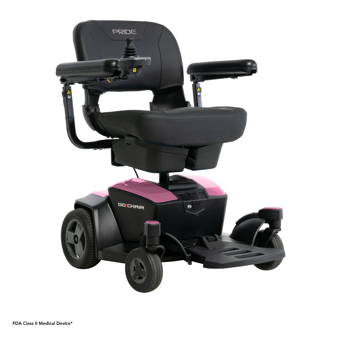 The Pride Mobility Go Chair® Portable Powerchair is a black and pink electric wheelchair with armrests, a right-side joystick controller, and four wheels, designed for personal mobility assistance.